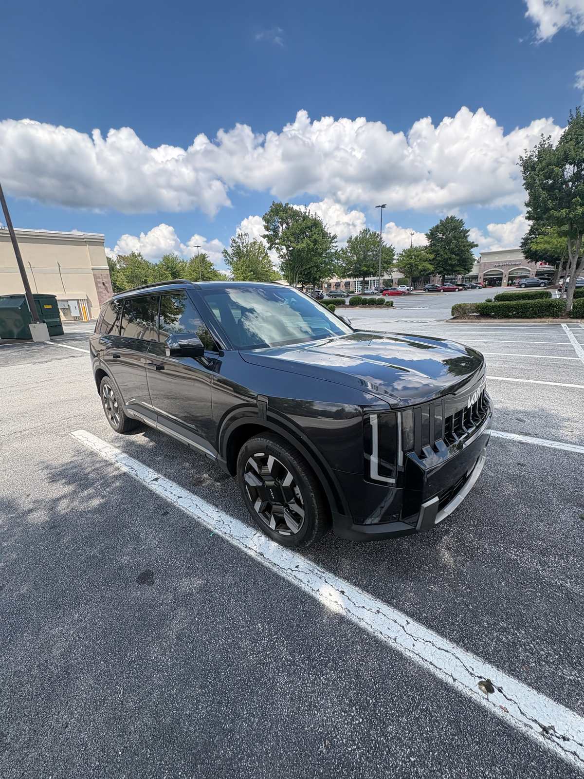 A black 2027 Kia Telluride S from the Seven Fleet Group fleet, front three-quarter view